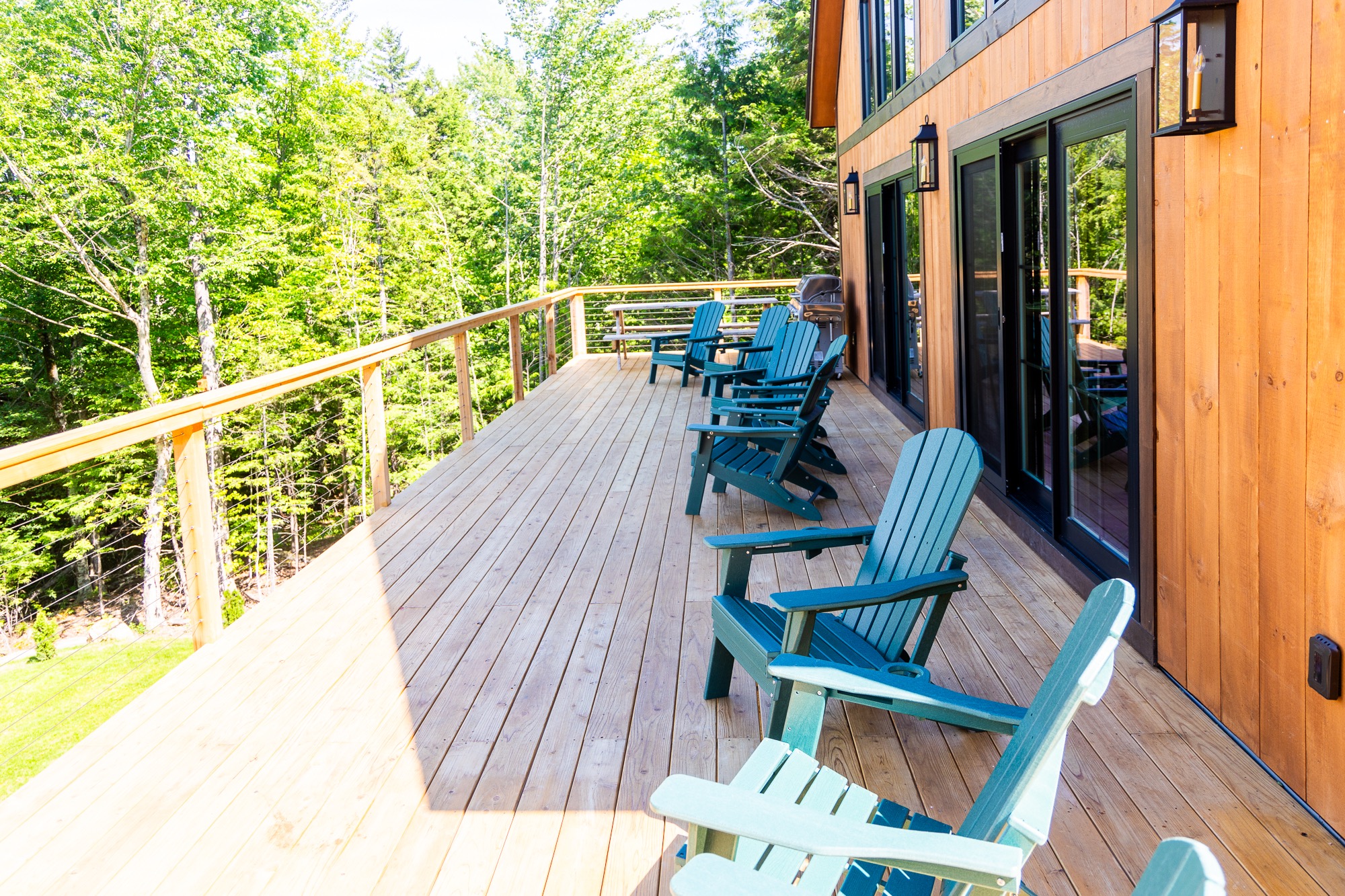 Spacious deck with Adirondack seating