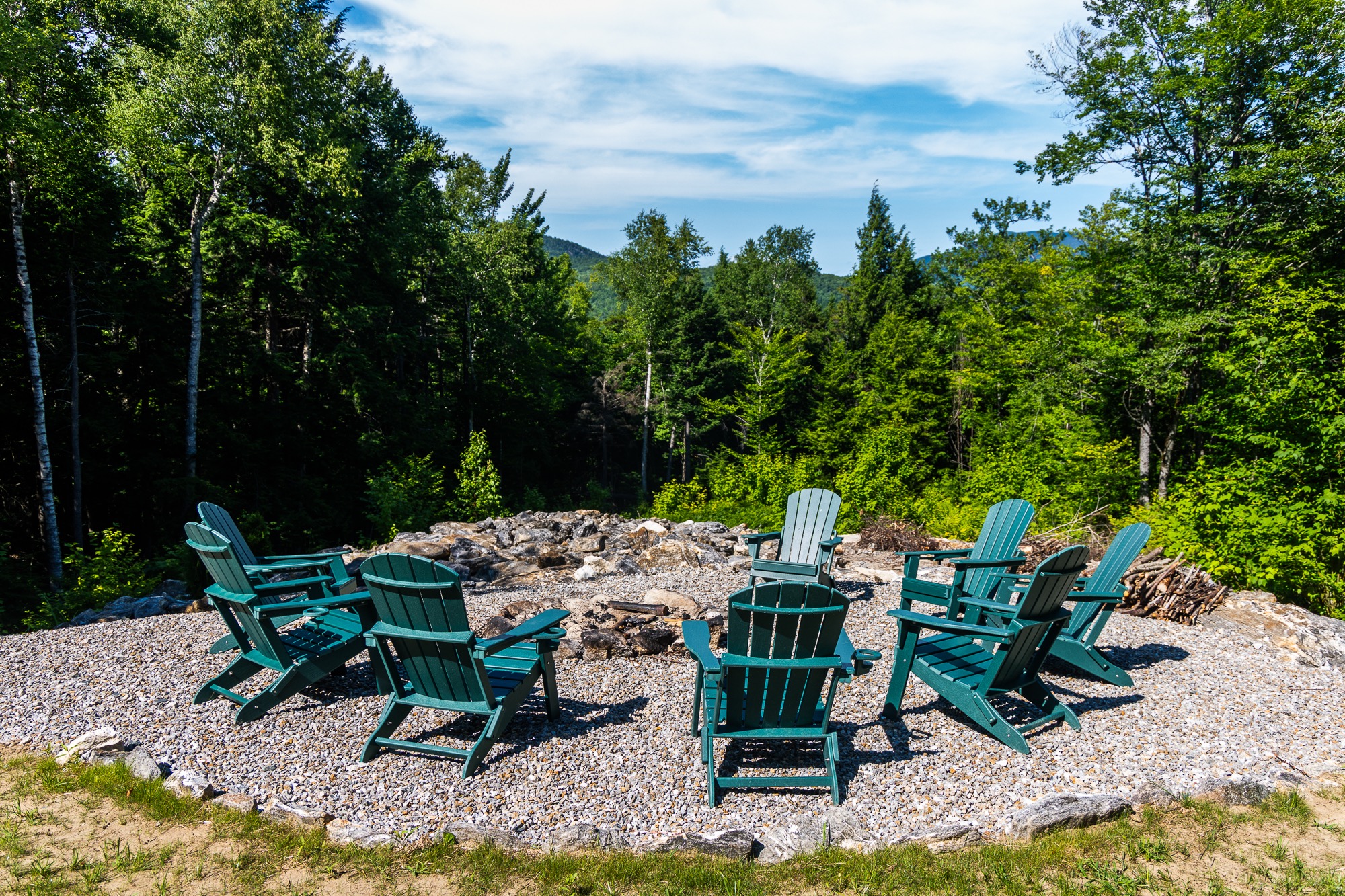 Outdoor fire pit with Adirondack chairs