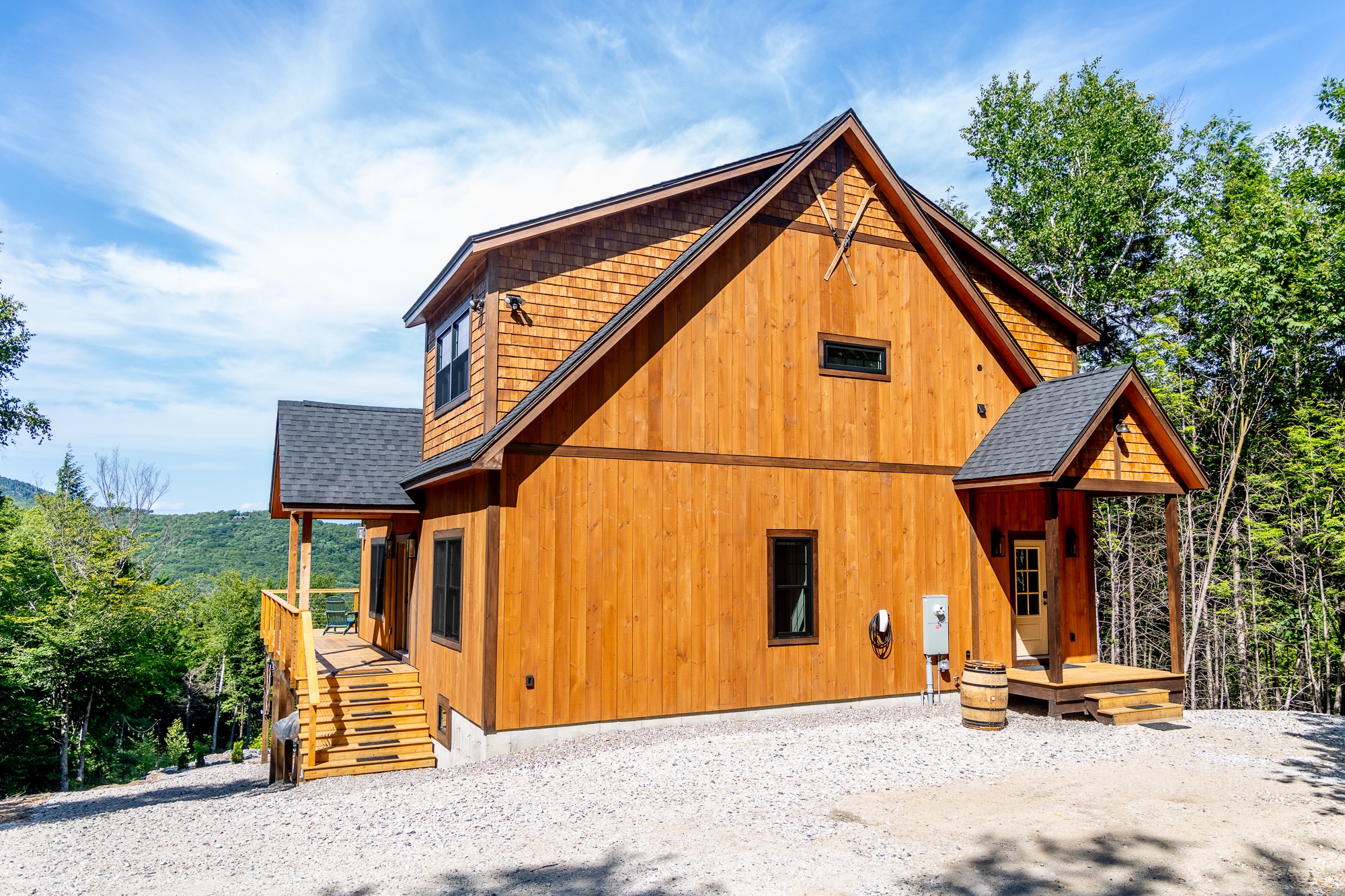 The Tourmaline mountain home in its wooded surroundings