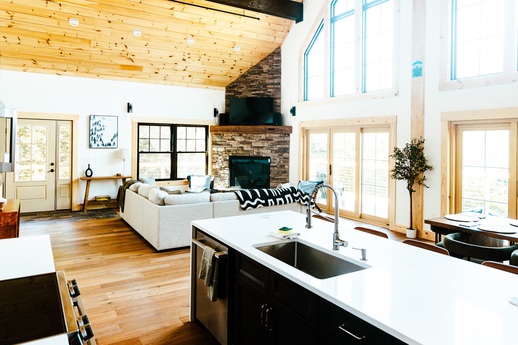 Great room with cathedral ceiling and stone fireplace